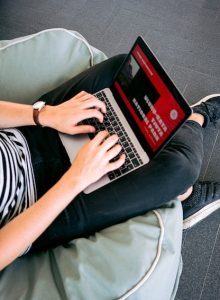 Person on laptop visiting website with Fast Web Hosting in Seattle Washington