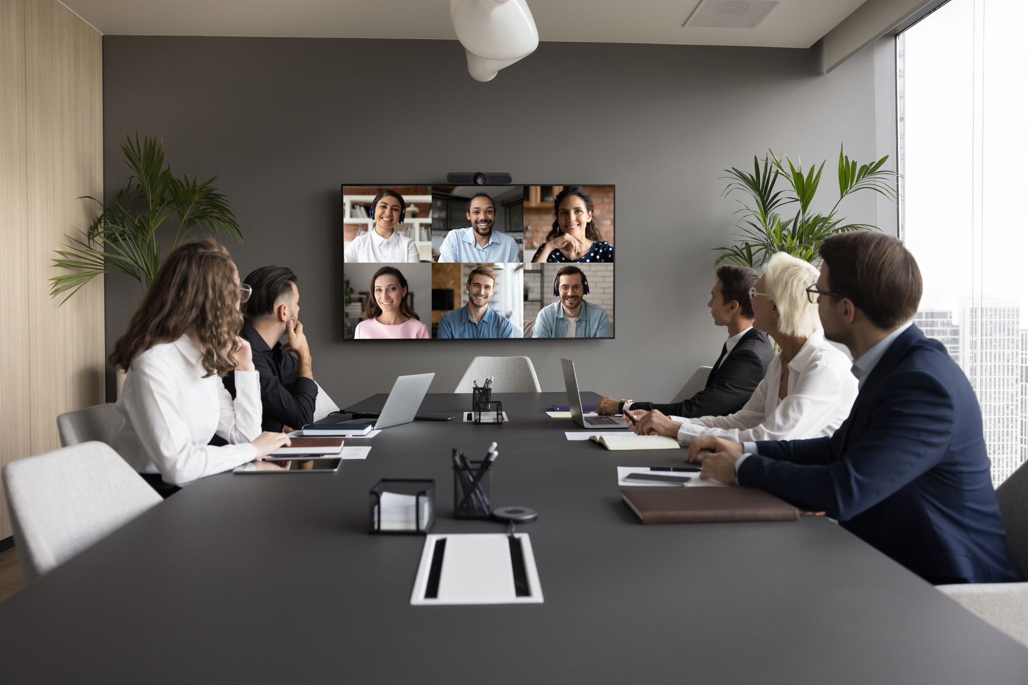 Office staff meeting with diverse team on online video conference